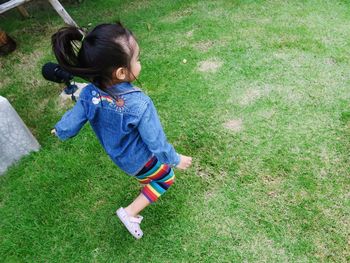 High angle view of girl on grass