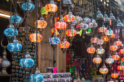 Multi colored lanterns hanging in store for sale