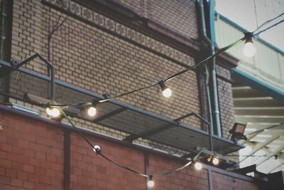 Low angle view of illuminated lamp