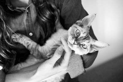 Full length of woman holding cat