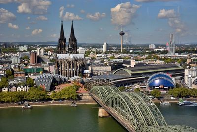 Panoramic view of buildings and city against sky