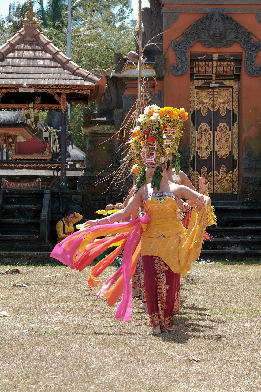 MIDSECTION OF WOMAN DANCING DURING CHRISTMAS