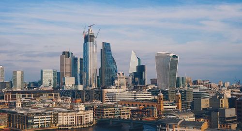 Modern buildings in city against sky