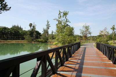 View of bridge over calm sea against sky