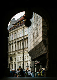 Group of people in front of building in prague