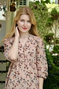 Portrait of a smiling young woman standing outdoors