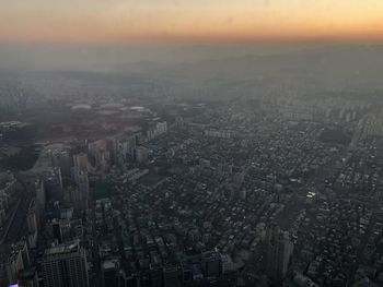 High angle view of cityscape against sky during sunset