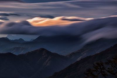 Scenic view of mountains against sky during sunset