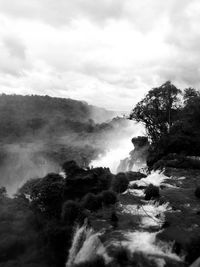 Scenic view of landscape against cloudy sky