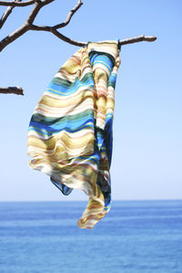 Low angle view of clothes hanging against clear sky