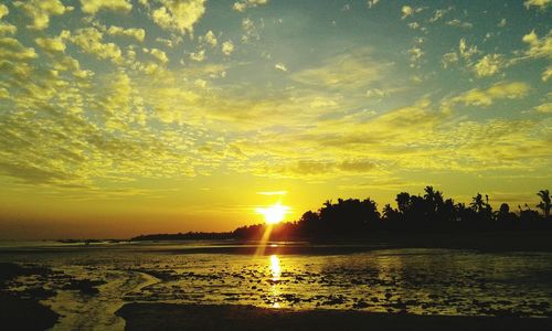 Scenic view of sunset over river