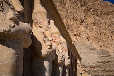 Low angle view of statue against wall