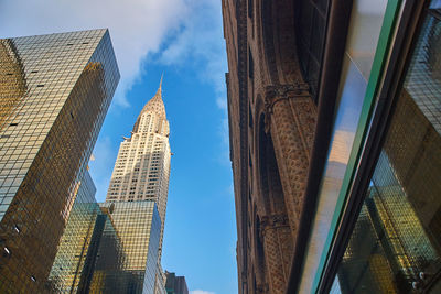 Low angle view of modern buildings against sky