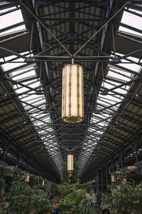 Low angle view of illuminated lights hanging from ceiling