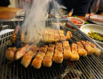 Close-up of meat on barbecue grill