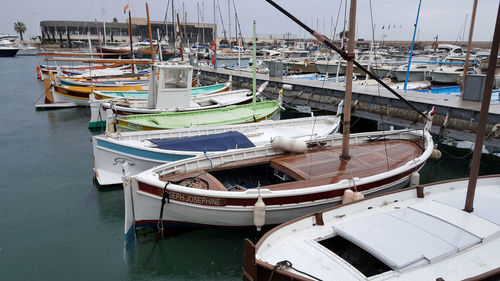 Boats moored at harbor