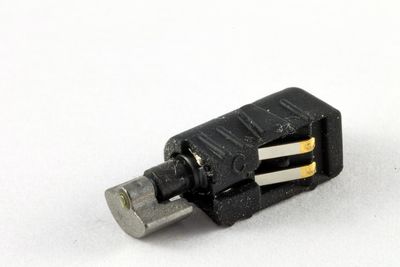 Close-up of machine part against white background