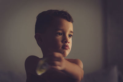 Close-up of cute boy at home