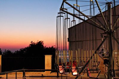 Empty amusement park ride during sunset