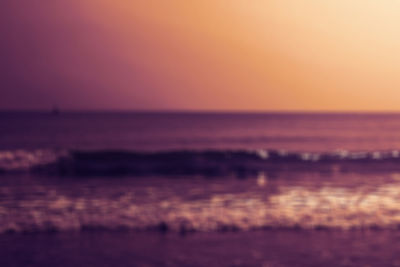 Scenic view of sea against romantic sky at sunset