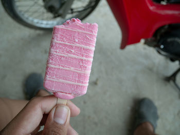 Midsection of person holding ice cream