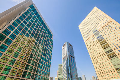 Low angle view of modern buildings against sky