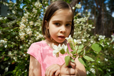 Portrait of cute girl with plants