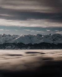 Scenic view of snowcapped mountains against sky