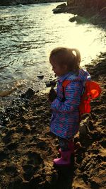 Full length of boy standing at beach