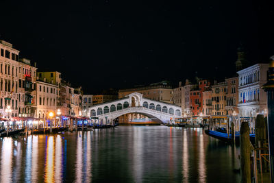 Beautiful view of grand canal and rialto bridge in venice, italy at night