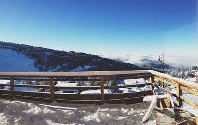 Scenic view of snow covered mountains against sky