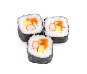 Close-up of sushi served on white background