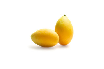 Close-up of oranges against white background