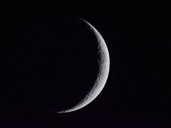 Low angle view of moon against sky at night