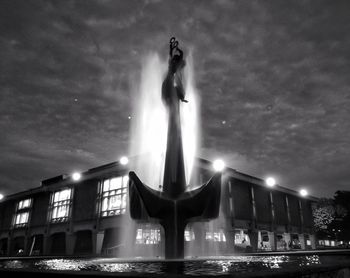 Low angle view of statue at night