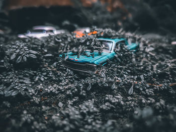 Close-up of damaged car on field