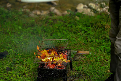 High angle view of fire on barbecue grill