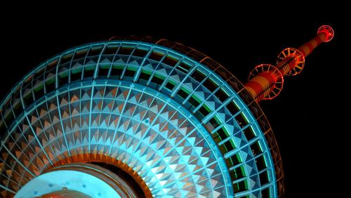 Low angle view of built structure against sky at night