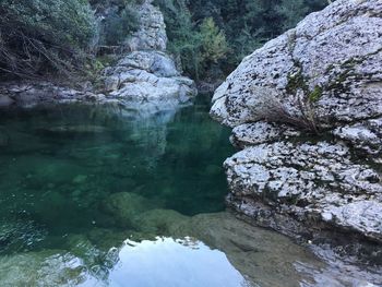 High angle view of lake by rock formation