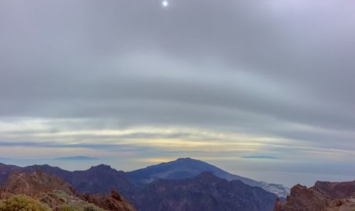 Scenic view of mountains against sky during sunset