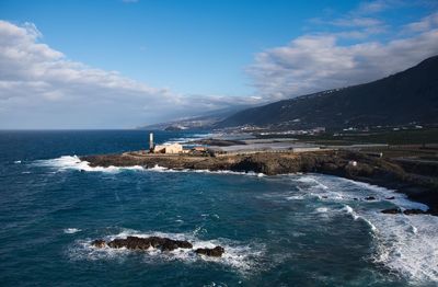 Scenic view of sea against blue sky