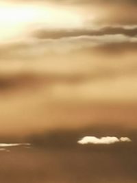 Close-up of sea against sky during sunset