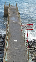 Information sign by sea