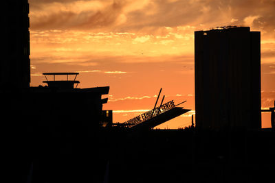 Silhouette of building at sunset