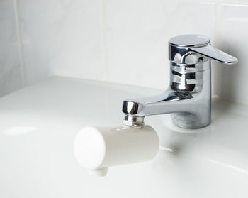 Close-up of faucet in bathroom