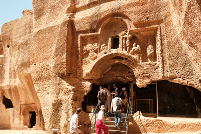 People in front of historic building