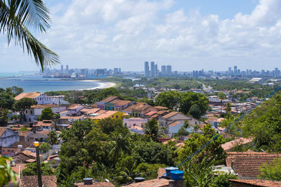 High angle view of buildings in city against sky