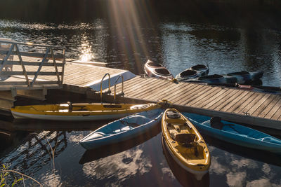 Kayaks moored on a small wooden pier