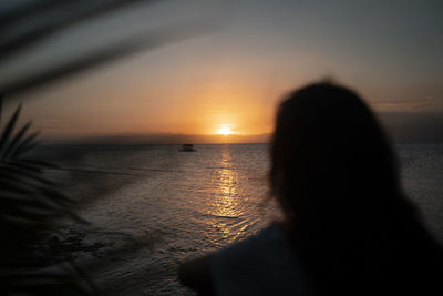 Silhouette woman on beach during sunset