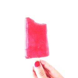 Female hand holding pink ice cream